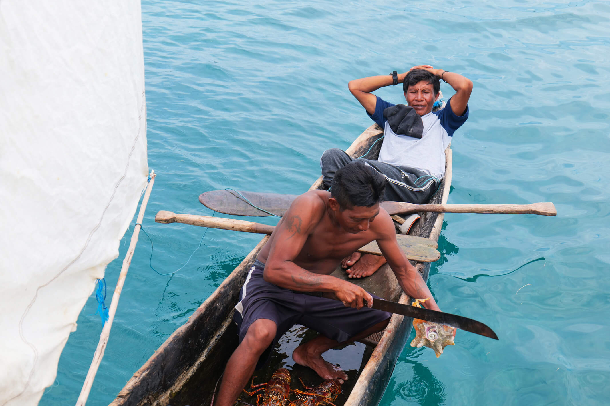 Guna people on traditional guna cayuco