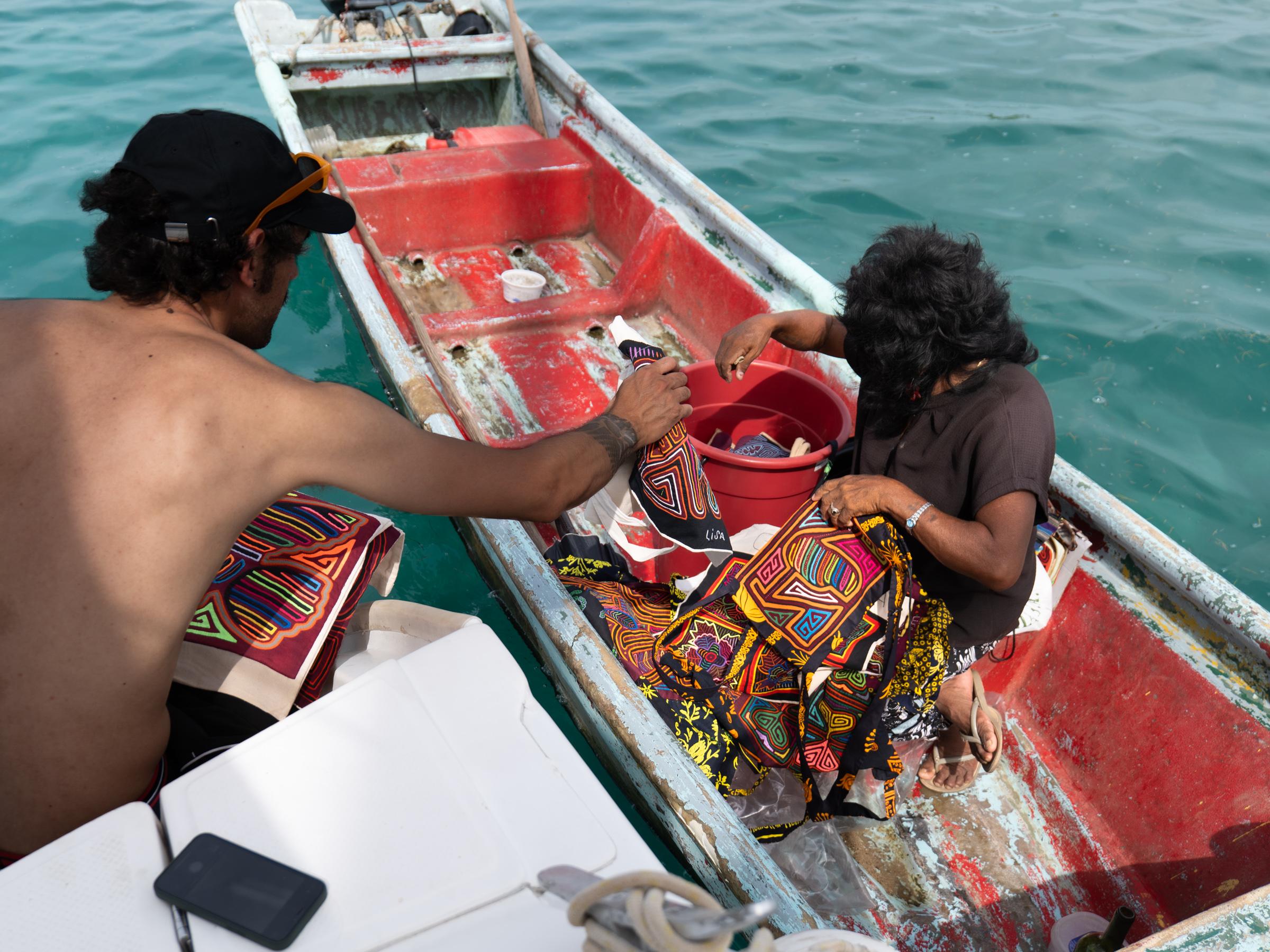 Is also very common to see Guna women approaching boats in their cayucos, offering handmade molas and traditional textiles