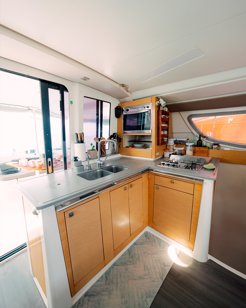 Starboard stern cabin on Catamaran Atila with comfortable bedding and natural light.