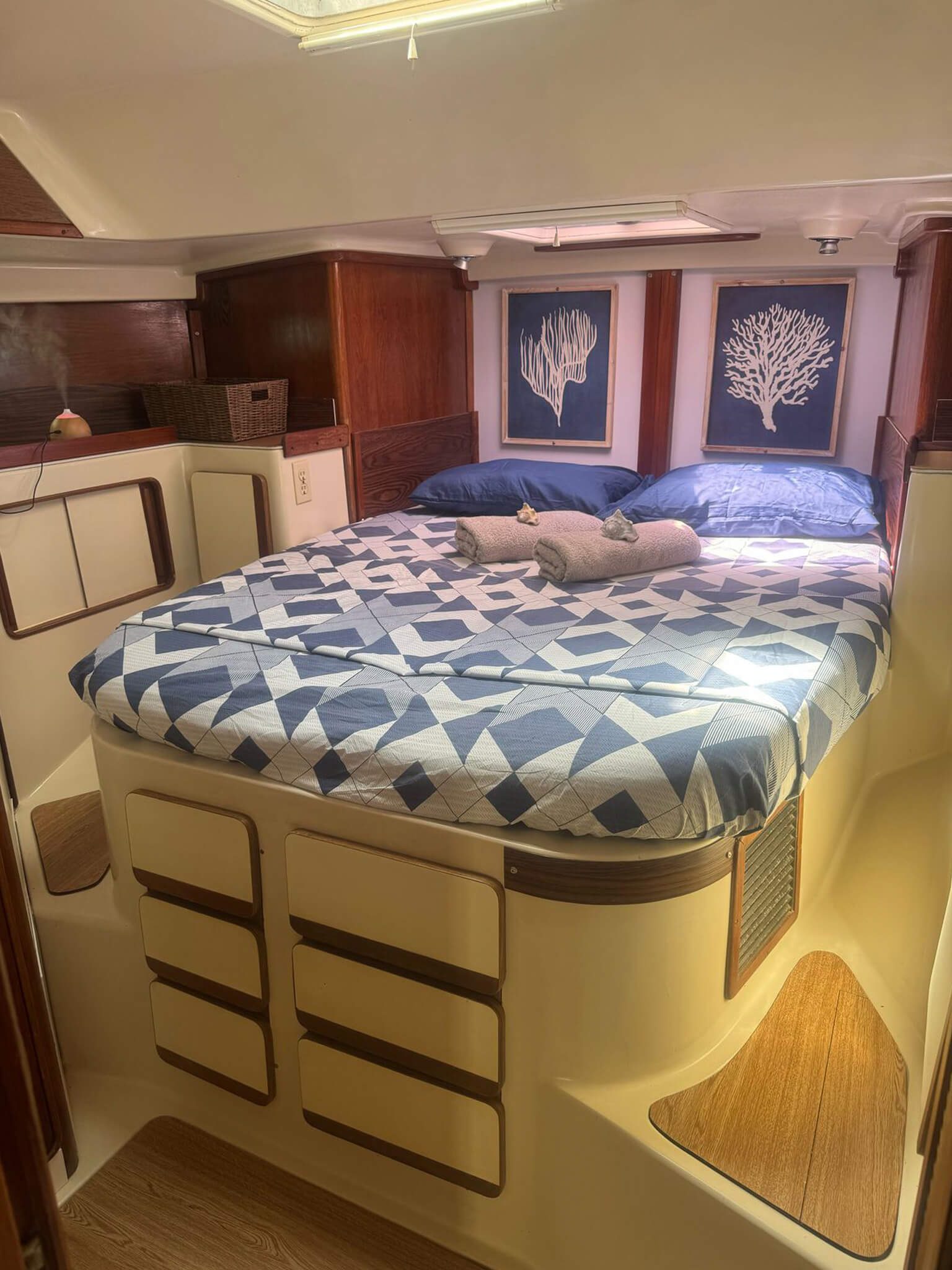 Starboard stern cabin on Catamaran Atila with comfortable bedding and natural light.